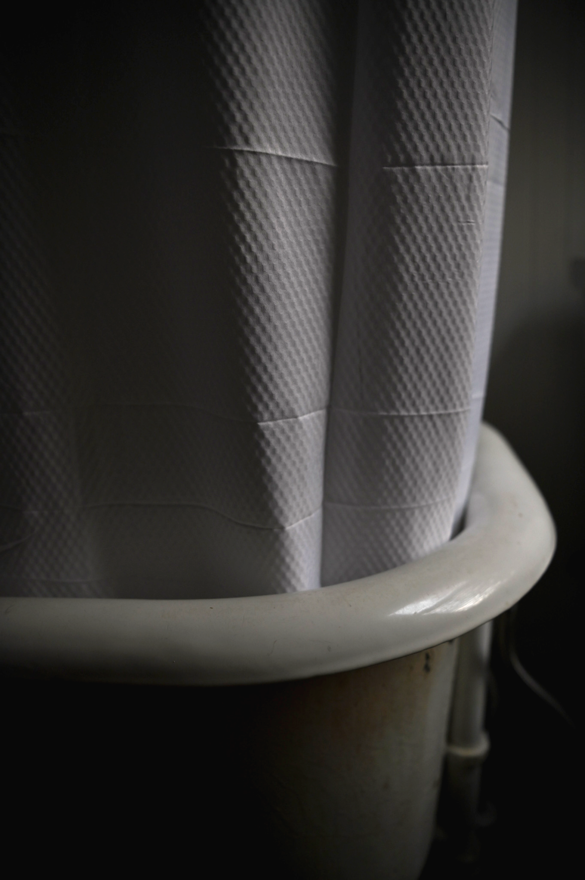 Pandemic Photo Essay: Shower curtain tucked into tub